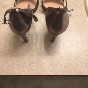 Woman’s size 12 pewter faux leather shoes.